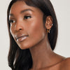 girl wearing hypoallergenic star shaped hoop earrings for bachelorette party