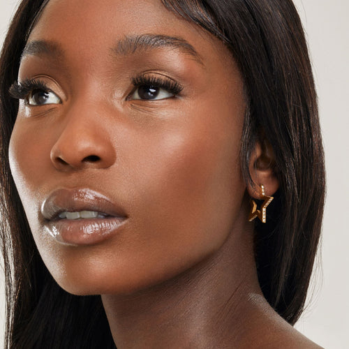 girl wearing crystal star shaped hoop earrings for bachelorette party