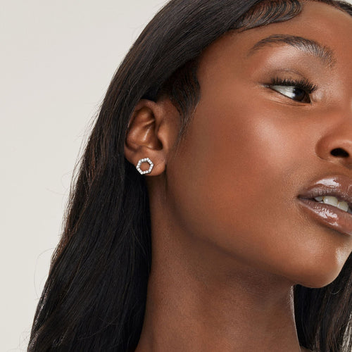 girl with one ear piercing wearing crystal nickel free stud bridal earrings