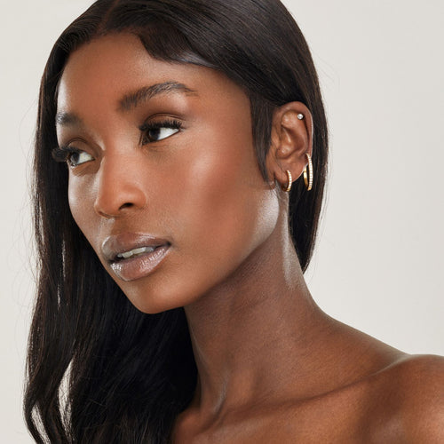 girl with 3 ear piercings wearing hypoallergenic affordable bridal jewelry