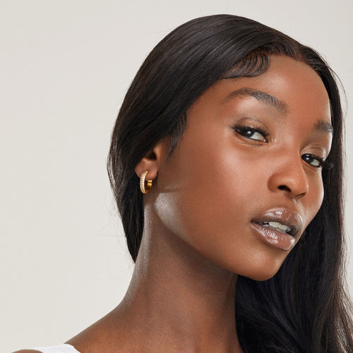 girl wearing gold nickel free hypoallergenic hoop earrings