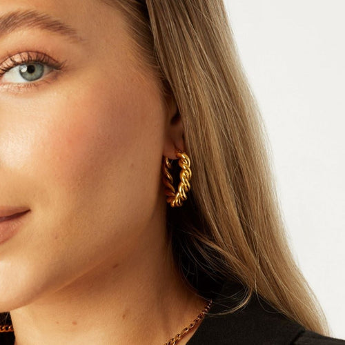 girl wearing large chunky hypoallergenic gold hoop earrings ||all