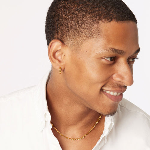 guy wearing hypoallergenic gold hoop earrings and titanium figaro chain ||all