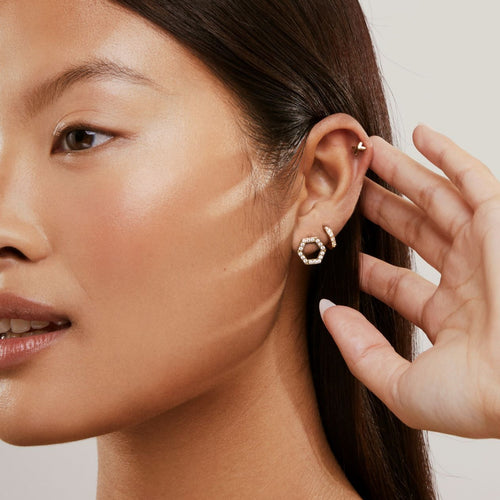 girl with 3 ear piercings wearing titanium wedding jewelry for brides 